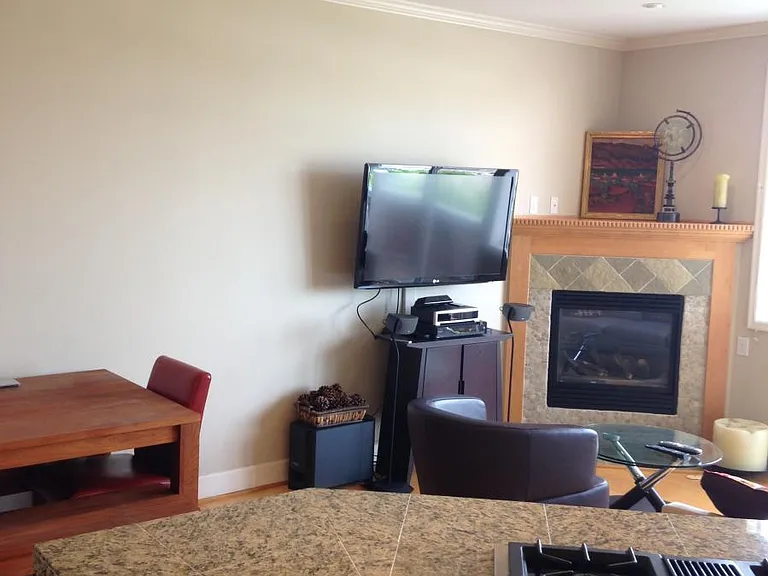 Mid level living area with gas fireplace