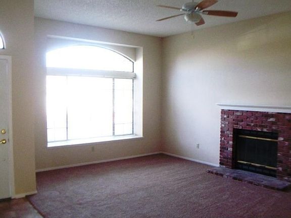 Open bright living room w/fireplace