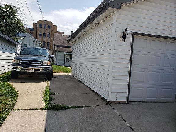 2 Stall Garage with opener and parking pad on side