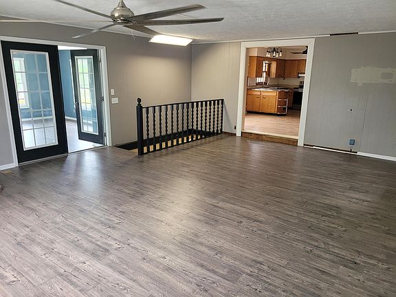 Family Room - opening into 4 season Solarium and Eat-in Dining / Kitchen