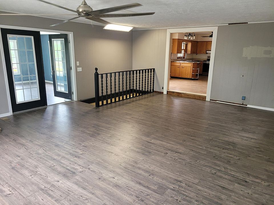 Family Room - opening into 4 season Solarium and Eat-in Dining / Kitchen