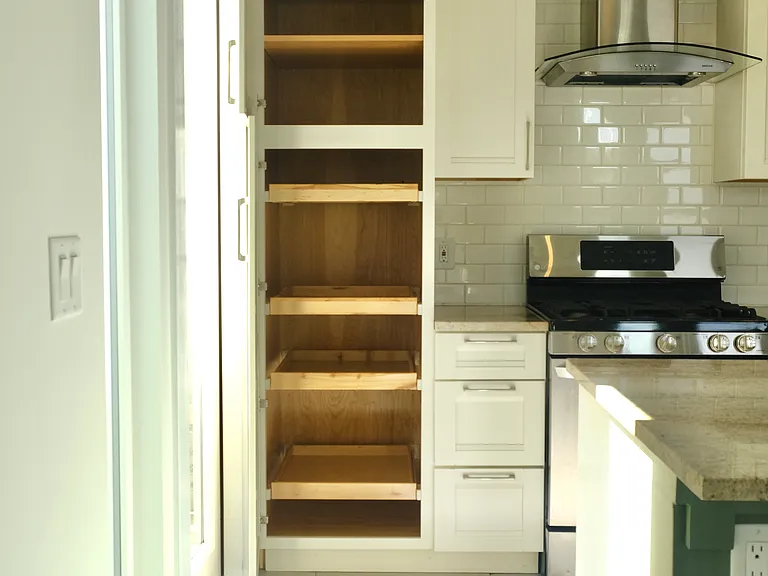 Lot's of extra depth pantry cabinet space with pull-out draws/shelves.