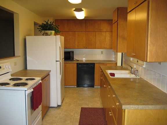 A slightly differeent look at the kitchen with the open area to the living room.
