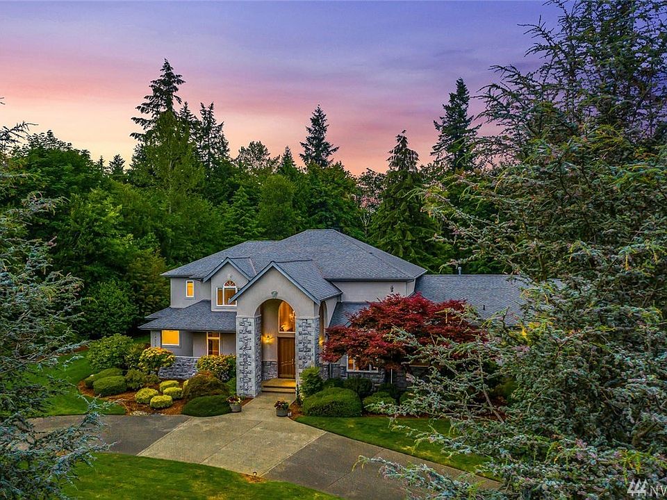 Welcome to your own peaceful, private slice of paradise! Nestled among nature, this custom home in Maple Valley was thoughtfully designed with spacious rooms, large windows, unique millwork, and custom features throughout. 