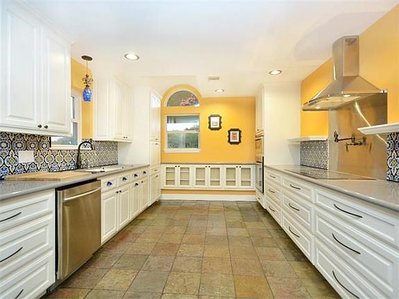 Stunning kitchen with crisp white cabinetry.