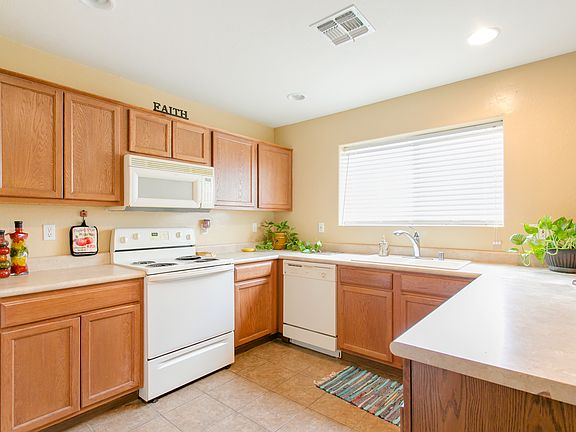 Kitchen overlooking backyard