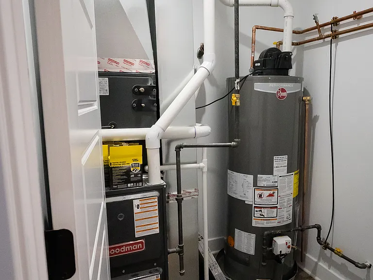 The unit features a dedicated furnace, air conditioning, and 50 gallon water heater