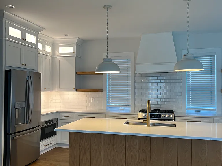 Kitchen with microwave drawer, oven, fridge, and dishwasher