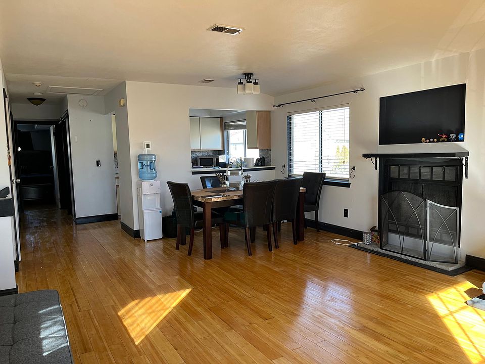 open floor plan Dining & Living room wood burning fireplace
