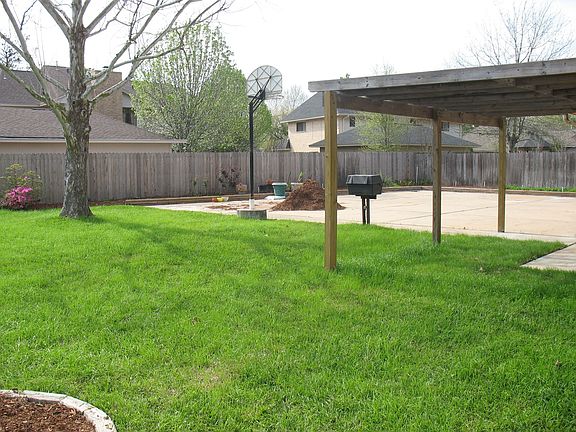 View of backyard.  Notice large amount of parking available.