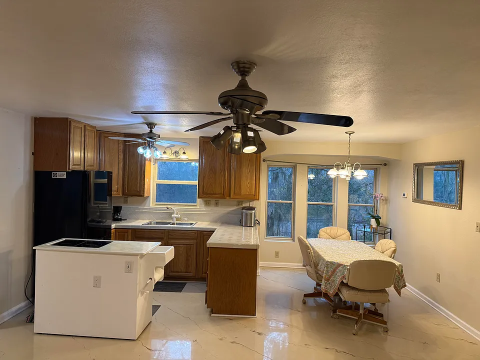 Kitchen and dining room area.

Epoxy Flooring. Large Spacious area.

Dining room furnishing