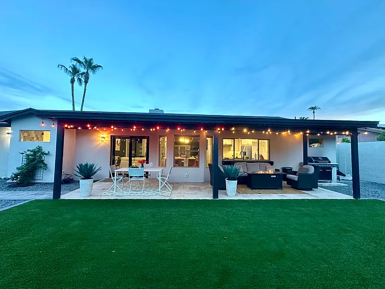 Private Backyard Oasis: 
Fully fenced yard equipped with a BBQ grill, dedicated outdoor dining area, and a comfortable sitting space_perfect for al fresco dinners and evening relaxation.