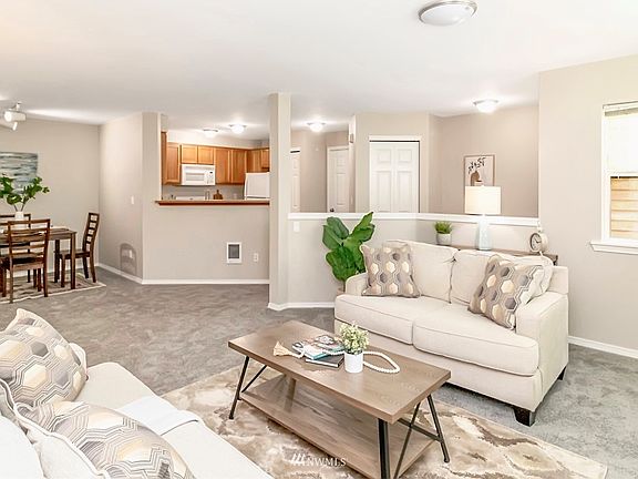 Open living room/kitchen area. New paint & flooring. Clean and fresh condo