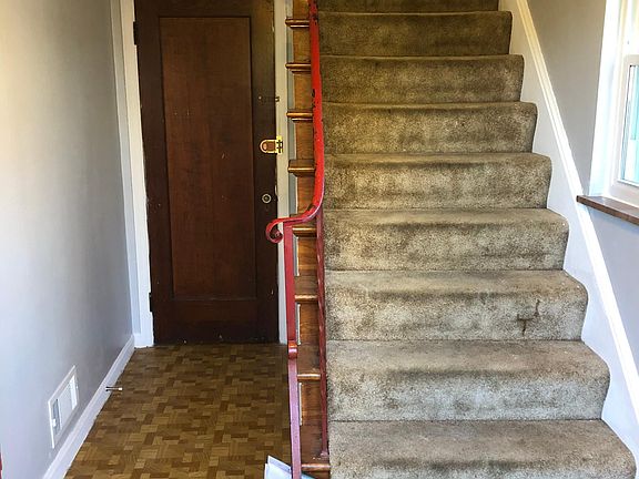 Upstairs to unit, downstairs to basement storage closet.