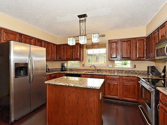 Kitchen with New Wood Floor and Pendant Lighting