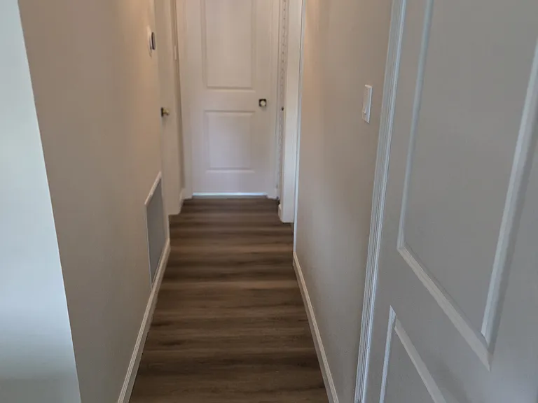 Hallway to bedrooms and bathroom.