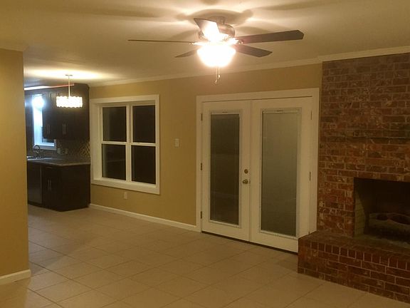 French doors to enormous backyard with mature tees. Oversiz