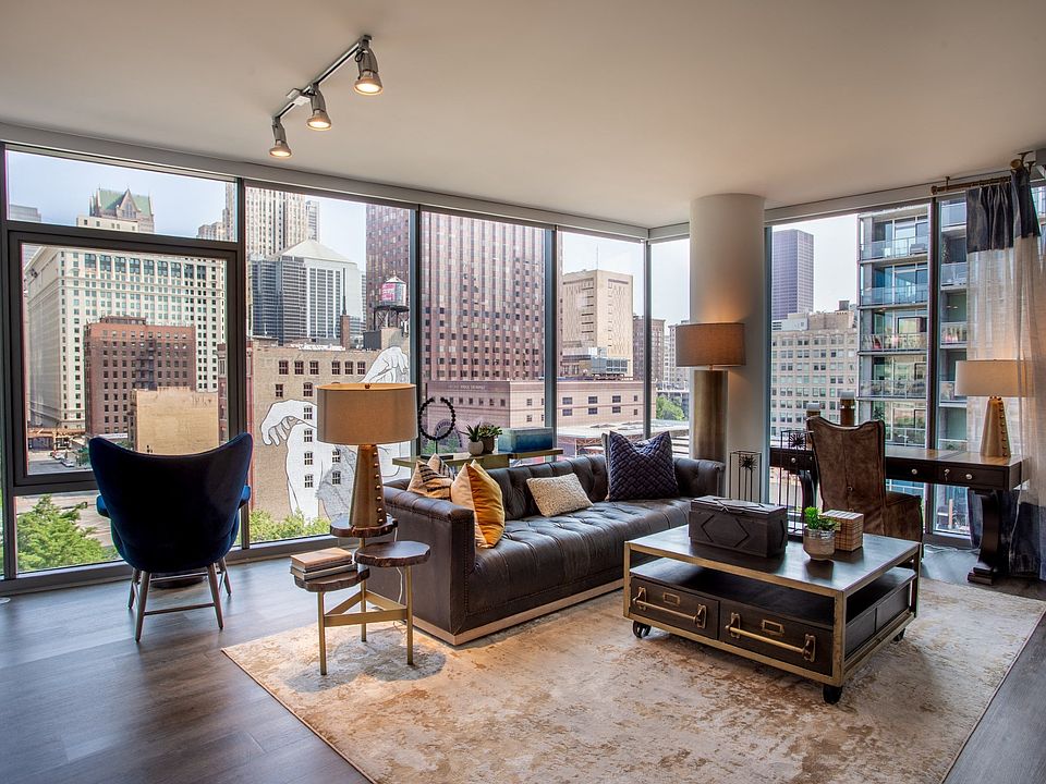 Living Room with Floor-to-Ceiling Windows at The Grand Central Apartments in Chicago, IL 60607