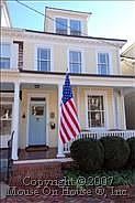 Front Exterior with Restored Clap-Board and Welcoming Front Porch