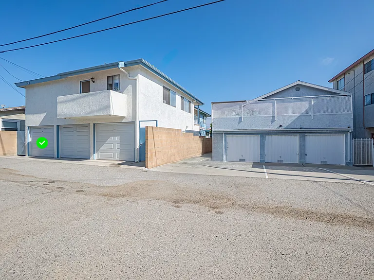 Garage is located in adjacent building with the green x. If you choose not to take the garage. Rent would be $50 less.