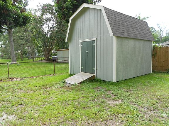 Large shed in back yard for storage.