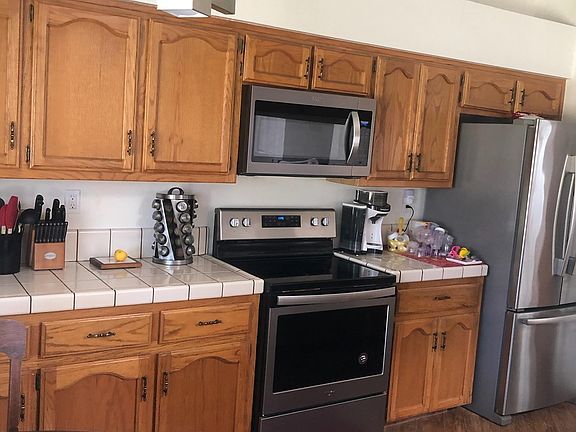 Kitchen stainless steel stove and microwave 1 year old. Refrigerator not included.