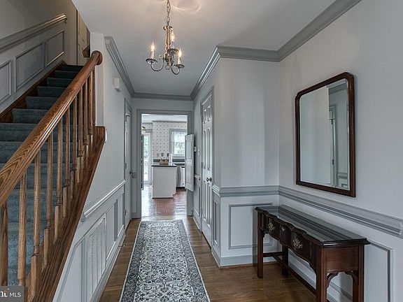 Inviting foyer with chair rail,  and box molding.