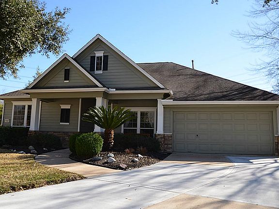 David Weekley home with clean landscaping and fresh entry
