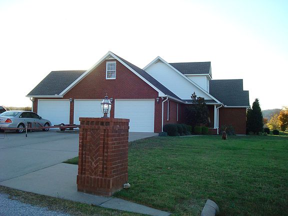 Three car garage and large parking area.