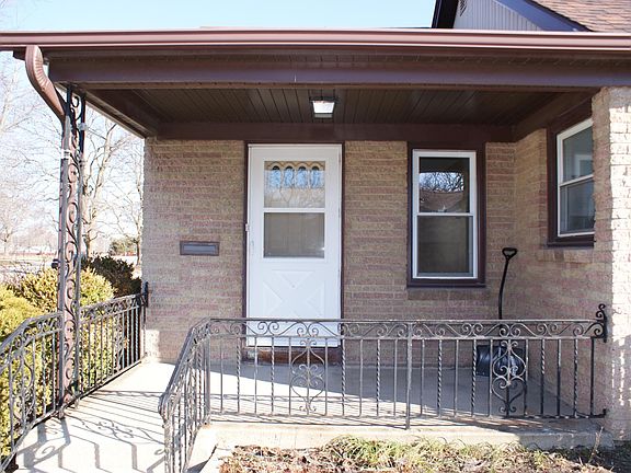 Front entrance with concrete deck.