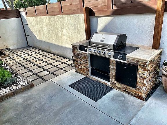 Side patio with grill