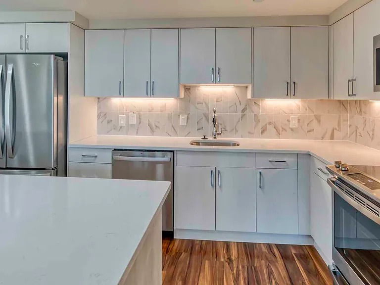 Premier homes feature modern kitchens with upgraded refrigerators, granite countertops and separate dining space