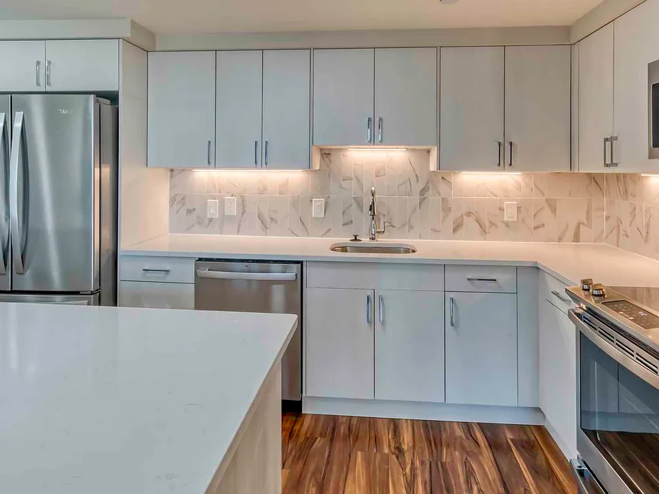 Premier homes feature modern kitchens with upgraded refrigerators, granite countertops and separate dining space