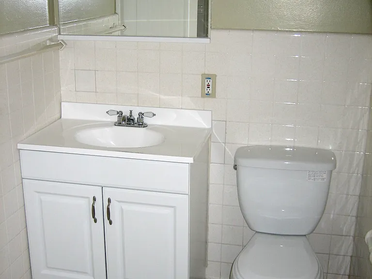 Upper bathroom with shower/tub.