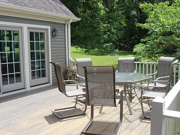 Front Porch with sliding glass doors accessing sunlit greatroom