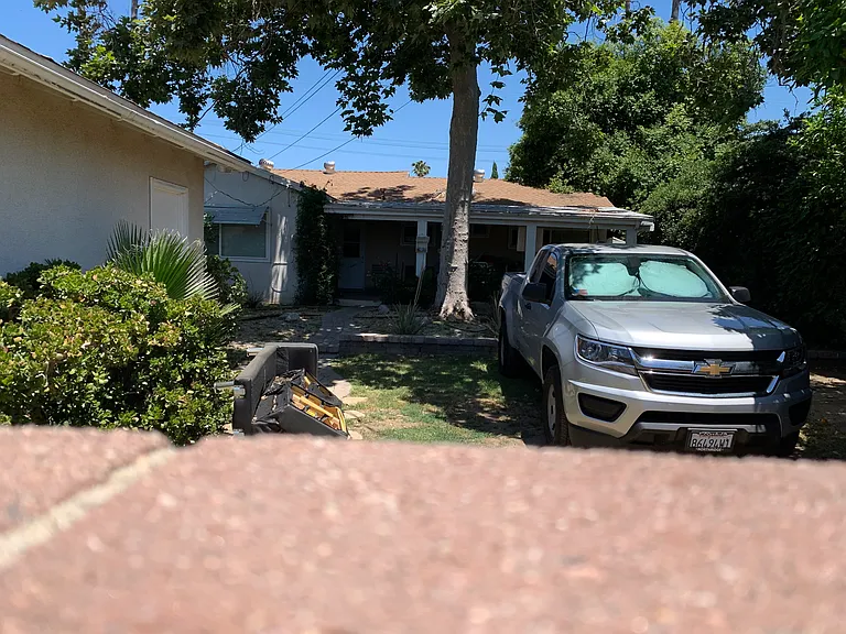 This secure parking area is at the rear of the property with access off the alley, there is a sliding gate