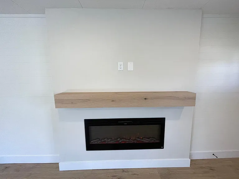Linear fireplace with floating beam mantle and connections for Flat TV above mantle