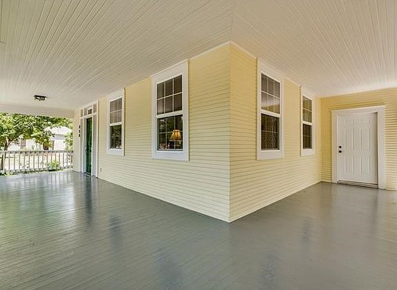View of front door, & master separate entrance.