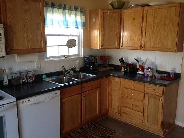 Kitchen sink, not showing new appliances.
