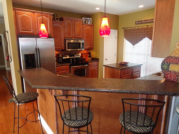 Kitchen with island and bar
