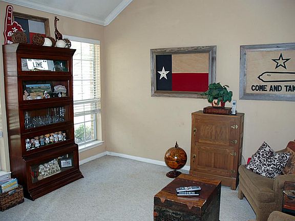 Lovely study with high ceilings off of the entry.