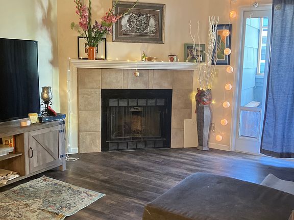 Living room with real wood burning fireplace.