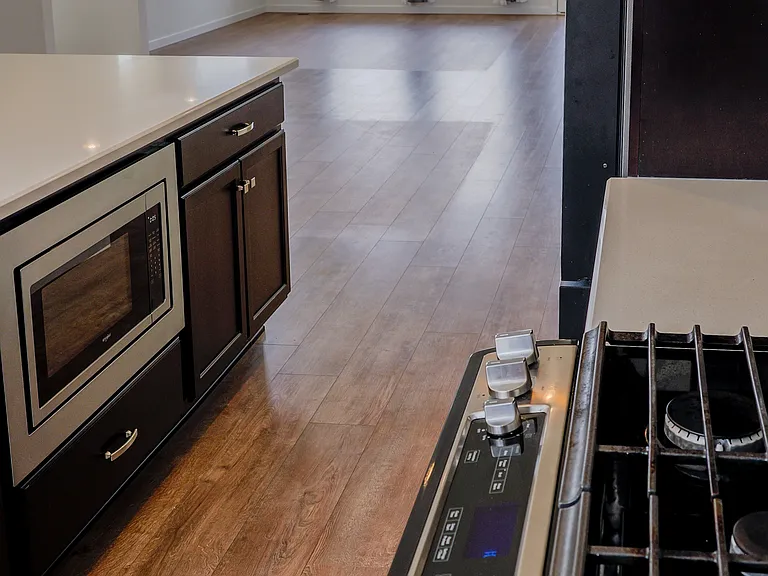 Chef inspired kitchen with oversized island, high end stainless steel appliances and Samsung Smart Hub Fridge