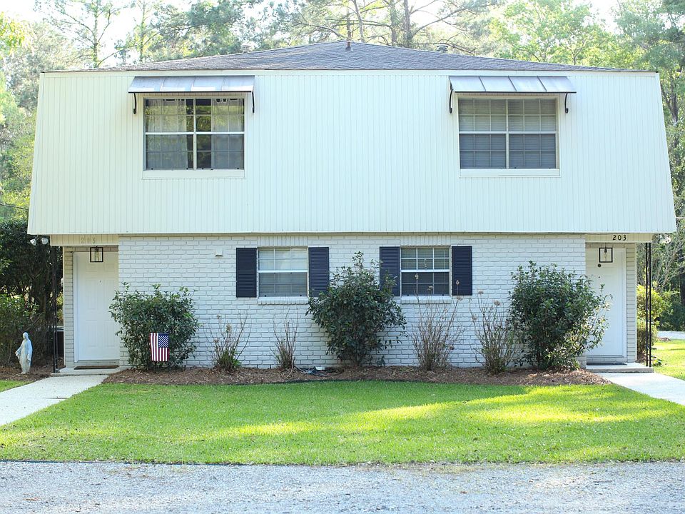 Duplex for rent is on the left side. Yard professionally maintained by owner.