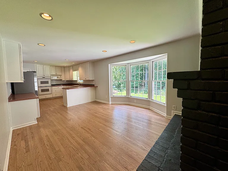 A large light filled eat-in kitchen with beautiful views of the backyard.