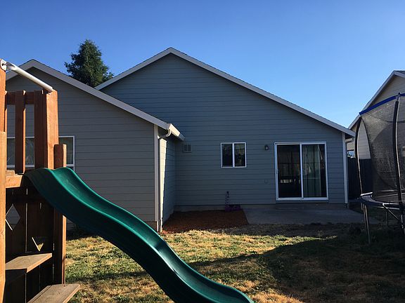 Back w/ concrete slab patio