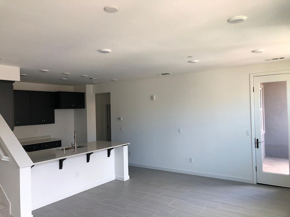 Living room, kitchen, glass door to a patio on 2nd level