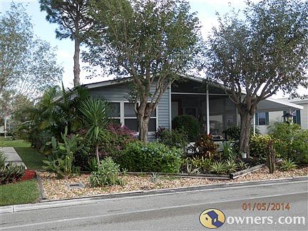 Front of house w/ shade trees