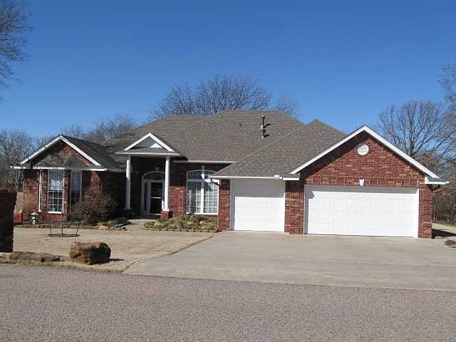 FRONT VIEW ON 1 ACRE CORNER LOT