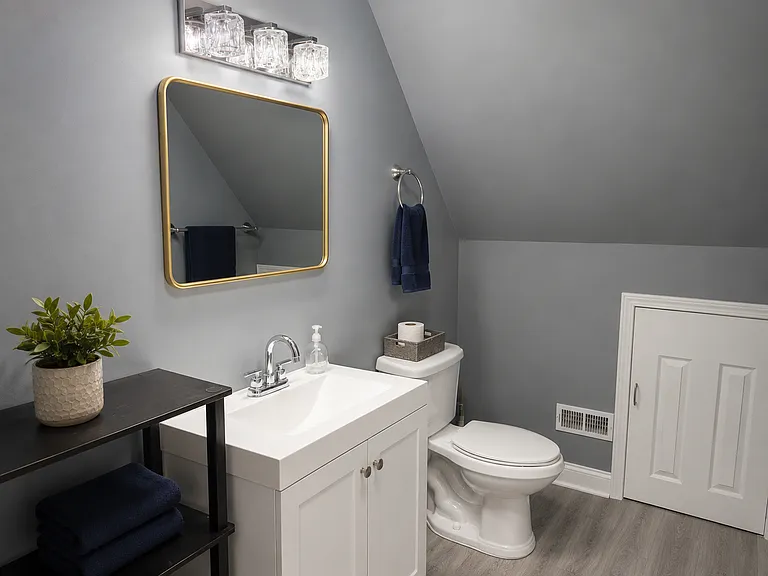 Second level full bathroom with shower and laundry attached.